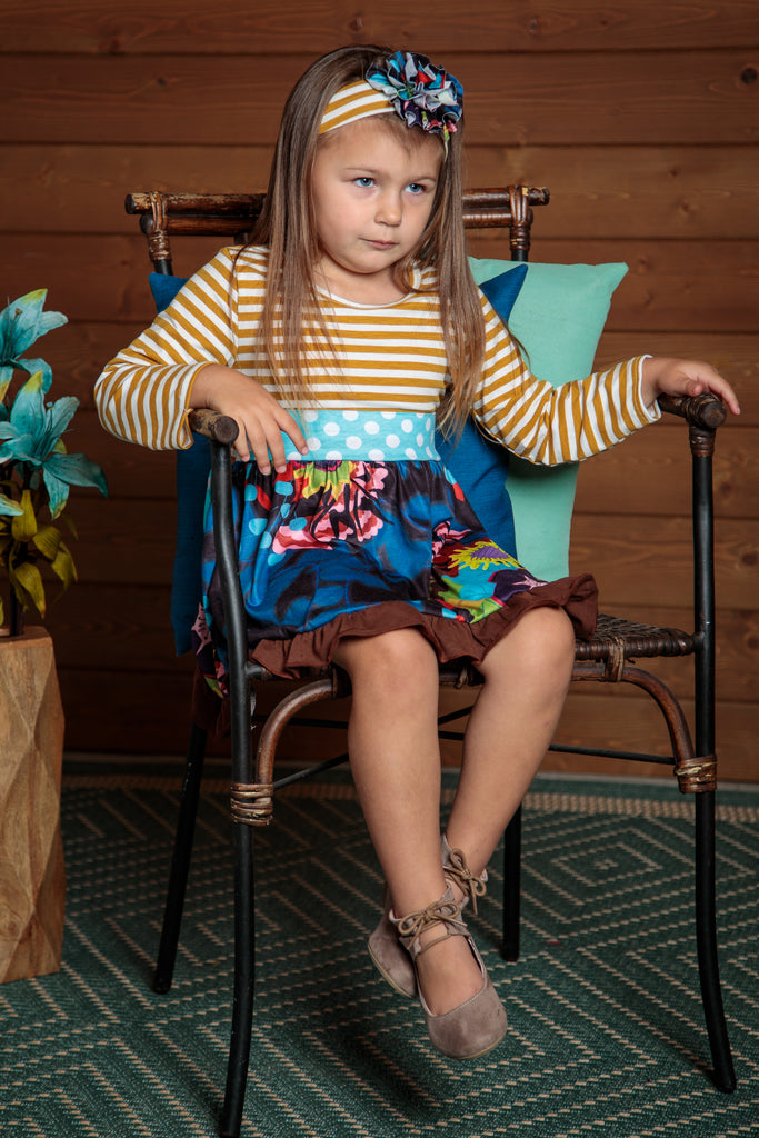 Gorgeous dress with tan stripes and blue floral skirt and a light blue polka dot sash. Sizes 2t-7t. 