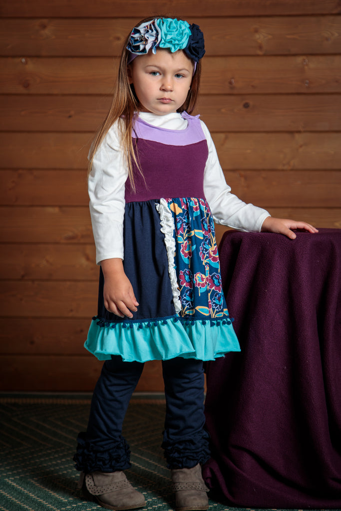 Purple, blue, and navy make up this 2 piece dress and pants outfit. Sizes 2t-7t. Mix and match or wear together.  